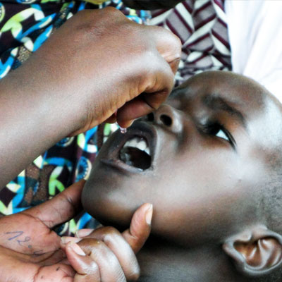 Child receiving medicine in Rwanda. 